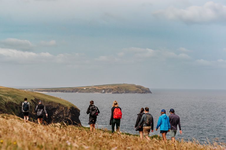 Walkers along a Cornish cliff top