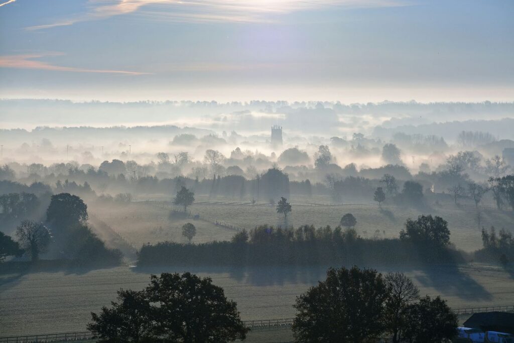 Hook Norton Church seen from a nearby hillside. Cotswolds, England