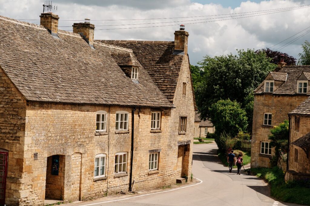 Walkers through Guiting Power, Cotswolds