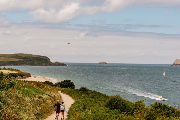 Walkers along a coastal track, Cornwall