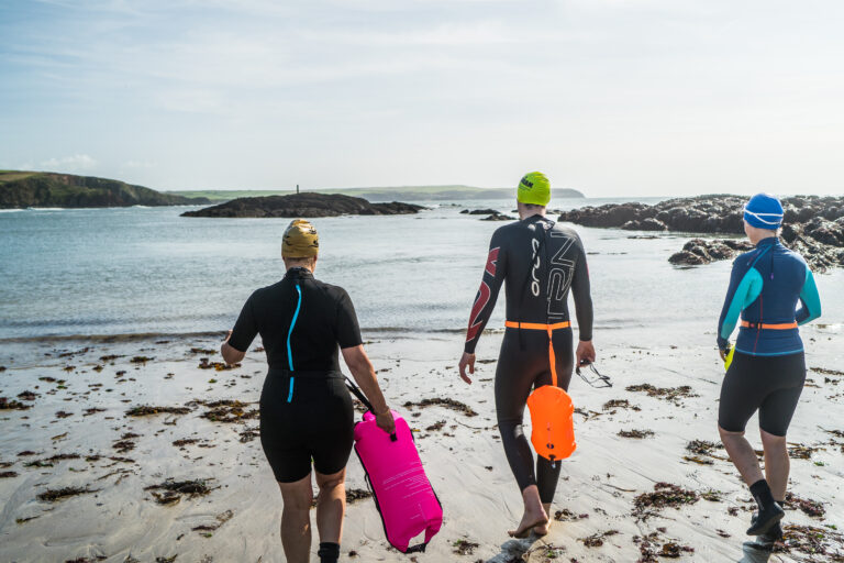 swimmers-entering-the-water-devon